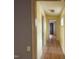 Hallway features laminate floors, light fixtures, and multiple doorways at 731 Latimer St, Hillsborough, NC 27278