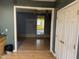 A view into the living room with blue walls from kitchen, showing connecting doorways at 731 Latimer St, Hillsborough, NC 27278
