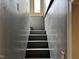 Picture of old stairs with dull gray walls, leading to the upper floor at 731 Latimer St, Hillsborough, NC 27278