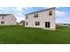Expansive backyard showcasing lush lawn and the home's rear exterior at 83 Paper Birch Way, Fuquay Varina, NC 27526