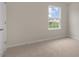 Well-lit bedroom with a window overlooking the yard and neighborhood at 83 Paper Birch Way, Fuquay Varina, NC 27526