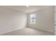 Clean bedroom with neutral walls and a bright window at 83 Paper Birch Way, Fuquay Varina, NC 27526