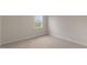 Neutral bedroom with wall-to-wall carpeting and bright window at 83 Paper Birch Way, Fuquay Varina, NC 27526
