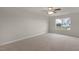Spacious bedroom featuring a ceiling fan and a window view at 83 Paper Birch Way, Fuquay Varina, NC 27526