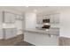 Bright kitchen with stainless steel appliances, a large island, and modern cabinetry at 83 Paper Birch Way, Fuquay Varina, NC 27526