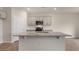Bright kitchen featuring a large island, stainless steel appliances, and neutral cabinetry at 83 Paper Birch Way, Fuquay Varina, NC 27526
