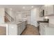 Bright kitchen with stainless steel appliances, a large island, and modern cabinetry at 83 Paper Birch Way, Fuquay Varina, NC 27526