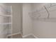 Walk-in closet with built-in shelving for organized storage at 83 Paper Birch Way, Fuquay Varina, NC 27526