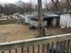 Large backyard with various outbuildings, offering ample storage and potential for customization at 925 Harris St, Burlington, NC 27217