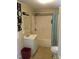 Bathroom featuring a shower-tub combo, toilet, and sink with vanity, in need of renovation at 925 Harris St, Burlington, NC 27217
