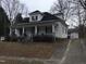 Inviting home with a covered front porch, showcasing its classic architecture and potential for outdoor living at 925 Harris St, Burlington, NC 27217