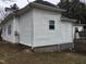 View of side exterior; shows the siding and window; part of a deck is visible in the image at 925 Harris St, Burlington, NC 27217