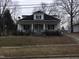 Charming home featuring a covered front porch and inviting curb appeal, perfect for relaxing outdoors at 925 Harris St, Burlington, NC 27217