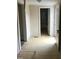 View of a hallway leading to a bathroom with tile flooring at 925 Harris St, Burlington, NC 27217
