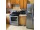 Functional kitchen features stainless steel appliances and ample countertop space at 925 Harris St, Burlington, NC 27217