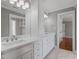 Bathroom featuring a double sink vanity with marble countertops, drawers, and cabinets for storage at 93 Shoreline Dr, Princeton, NC 27569