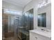 Sleek bathroom featuring a glass enclosed shower with gray tile and modern fixtures at 93 Shoreline Dr, Princeton, NC 27569