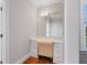 Bathroom vanity area features granite countertop, drawers, and an elegant chair at 93 Shoreline Dr, Princeton, NC 27569