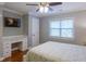 Cozy bedroom with built-in desk, ceiling fan and natural light at 93 Shoreline Dr, Princeton, NC 27569