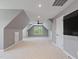 Spacious bonus room with neutral carpet, fan, dormer window and recessed lighting at 93 Shoreline Dr, Princeton, NC 27569