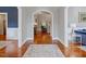 Elegant foyer with hardwood floors, arched doorway, and neutral paint creates an inviting entrance at 93 Shoreline Dr, Princeton, NC 27569