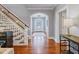 Inviting foyer with hardwood floors, grand staircase, and decorative front door at 93 Shoreline Dr, Princeton, NC 27569