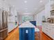 Open kitchen layout with a large island, white cabinetry, and stainless appliances at 93 Shoreline Dr, Princeton, NC 27569