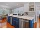 Spacious kitchen island with a sink, dishwasher, and open breakfast area at 93 Shoreline Dr, Princeton, NC 27569