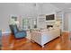 Spacious living room boasts tall ceilings, a fireplace, and hardwood floors at 93 Shoreline Dr, Princeton, NC 27569