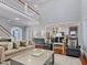 Open-concept living room with tall ceilings connecting to the kitchen area at 93 Shoreline Dr, Princeton, NC 27569
