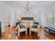 Spacious main bedroom with a decorative chandelier and hardwood floors at 93 Shoreline Dr, Princeton, NC 27569