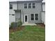 Backyard view featuring a well-maintained lawn and lush greenery at 104 Lavender Ln, Clayton, NC 27520