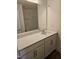 Bathroom featuring a vanity with a white countertop and a large mirror at 104 Lavender Ln, Clayton, NC 27520