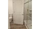 Bathroom featuring a modern glass-enclosed shower, toilet, and neutral flooring at 104 Lavender Ln, Clayton, NC 27520