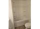 Bathroom featuring a shower and tub combination with a toilet and vinyl flooring at 104 Lavender Ln, Clayton, NC 27520