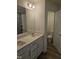 Bathroom featuring double vanity with a view to the water closet at 104 Lavender Ln, Clayton, NC 27520