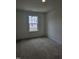 Cozy bedroom with a view from the window and carpet at 104 Lavender Ln, Clayton, NC 27520