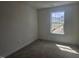 Comfortable bedroom with carpet, a window providing natural light and neighborhood views at 104 Lavender Ln, Clayton, NC 27520