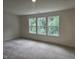 Bedroom with three windows showcasing views of the trees outside at 104 Lavender Ln, Clayton, NC 27520