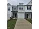 Charming two-story townhome with a well-maintained lawn and attached garages at 104 Lavender Ln, Clayton, NC 27520