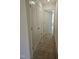 Hallway featuring carpeting, a closet, and access to a bedroom at 104 Lavender Ln, Clayton, NC 27520