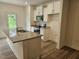 Kitchen boasting granite countertops, white cabinetry, and stainless steel appliances at 104 Lavender Ln, Clayton, NC 27520