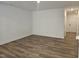 Spacious living room area with neutral walls and wood-look flooring at 104 Lavender Ln, Clayton, NC 27520