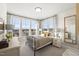 Inviting bedroom featuring large windows, neutral decor, and comfortable furnishings, great for relaxation at 10531 Pleasant Branch Dr # 201, Raleigh, NC 27614