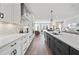 Well-designed kitchen with white cabinets, stainless steel appliances, and an open layout to the living area at 10531 Pleasant Branch Dr # 201, Raleigh, NC 27614