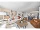 Bright and airy living room with an open floor plan, neutral decor, and seamless flow to kitchen at 10531 Pleasant Branch Dr # 201, Raleigh, NC 27614
