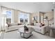 Inviting living room featuring neutral colors, hardwood floors, large windows, and comfortable seating at 10531 Pleasant Branch Dr # 201, Raleigh, NC 27614