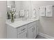 Light and bright bathroom with white cabinets, quartz countertops, and neutral color scheme at 10533 Pleasant Branch Dr # 201, Raleigh, NC 27614