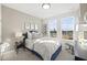 Charming bedroom filled with bright natural light and refined decor including dark wood night stand at 10533 Pleasant Branch Dr # 201, Raleigh, NC 27614