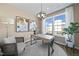 Cozy home office with a modern desk, artwork, and natural light from large windows at 10533 Pleasant Branch Dr # 201, Raleigh, NC 27614